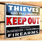 Keep out sign protected with firearms