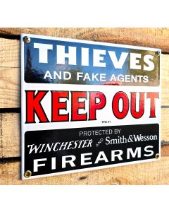 Keep out sign protected with firearms enamel sign